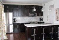 Kitchens With Brown Cabinets And Black Countertops
